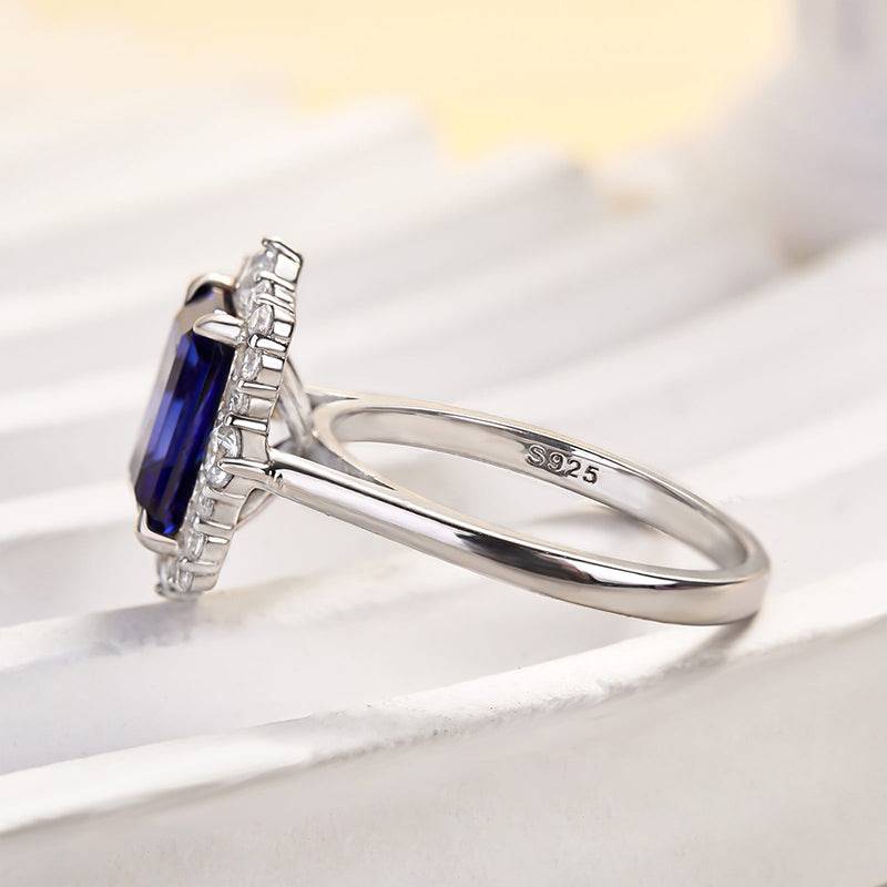 Halo Emerald Cut Blue Sapphire Ring